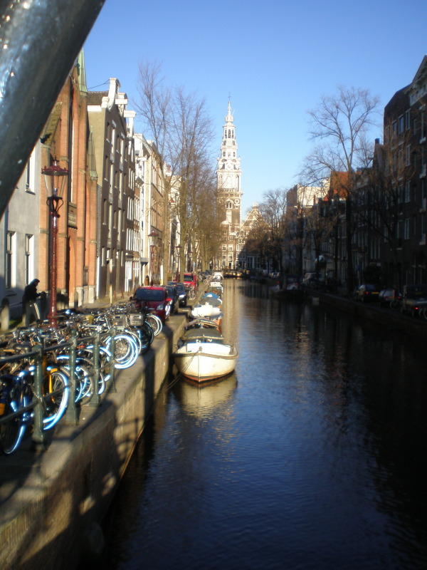 Boats, bicycles and buildings by the canal in Amsterdam