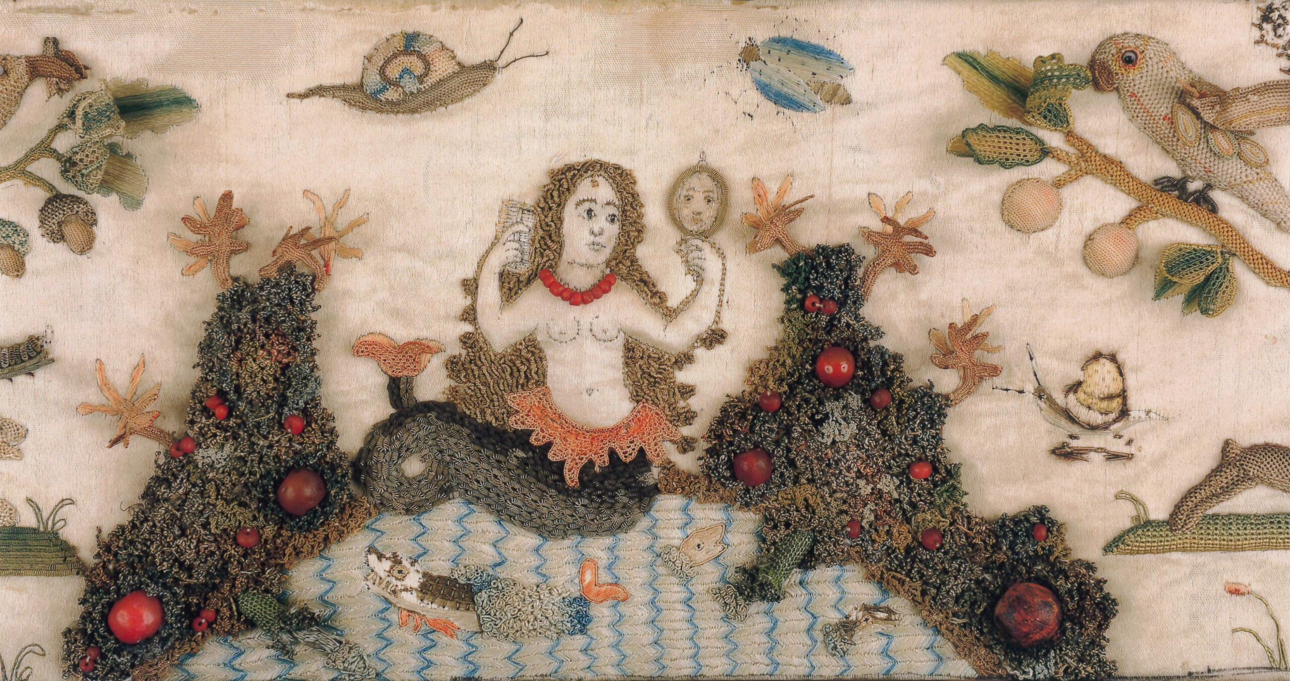 Raised embroidery depicting a mermaid