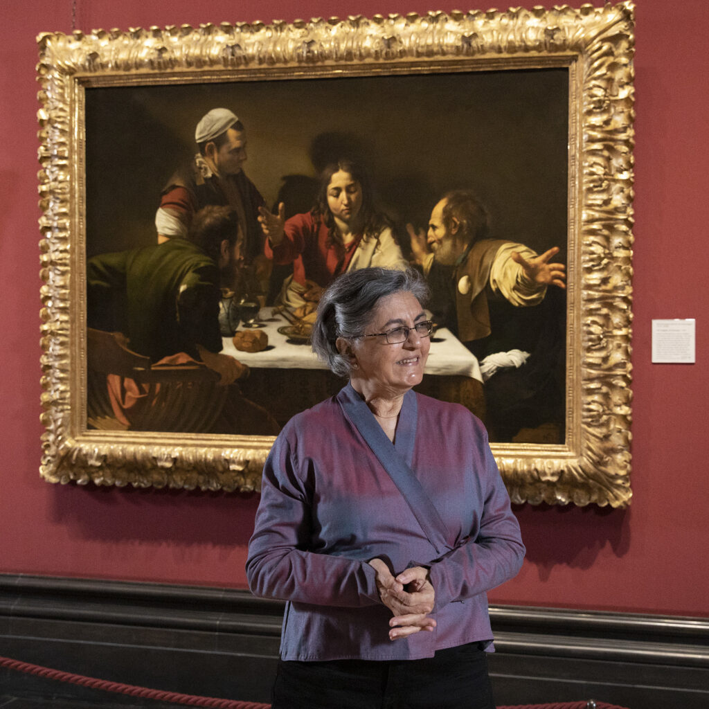 Nalini Malani in front of Caravaggio’s The Supper at Emmaus at the National Gallery © Photo: The National Gallery, London