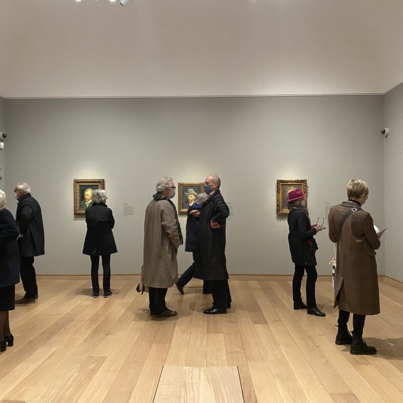 People wandering in a gallery